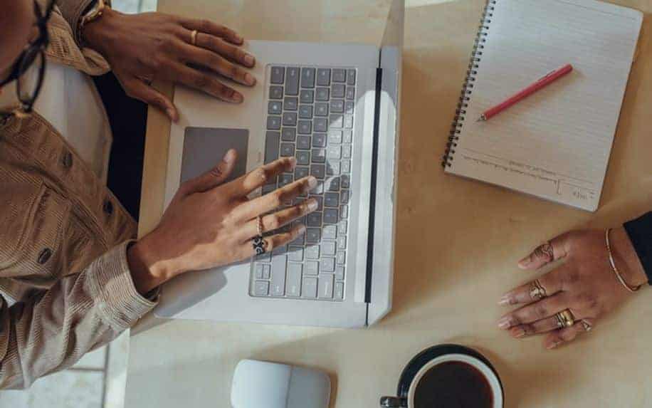 Content Writing Services woman typing on laptop