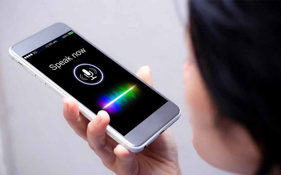 person using voice search on apple iphone