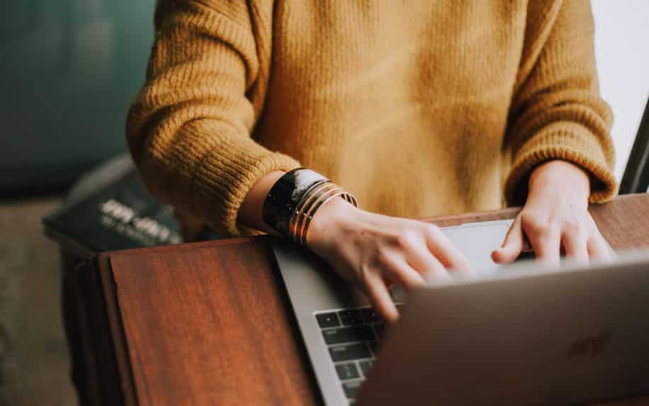 Woman typing on laptop - Website Launch