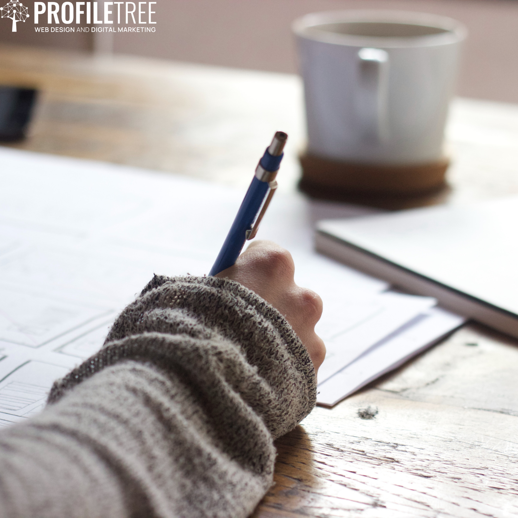 Image of someone writing in a notebook